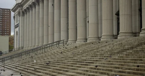 Slow Motion Of Birds Flying On The Steps United States Postal Service Building  Stock Footage 111880033