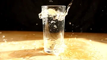 SLOW MOTION - Bitcoin BTC gold cryptocurrency coin fall in water  Stock Footage 85689663