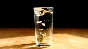 SLOW MOTION - Bitcoin BTC gold cryptocurrency coin fall in water splash Stock Footage 85689684