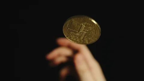 SLOW MOTION: Bitcoin is tossed and caught - Top View 스톡 동영상 99672906