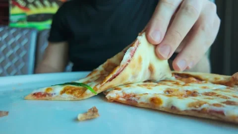 Slow Motion Bite Of Salami Pizza Showing Fast Food Consumption And Craving Today Stock Footage 341923119