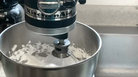 A slow motion of a Black KitchenAid Artisan Series Tilt-Head Stand Mixer Stock Footage 209016602