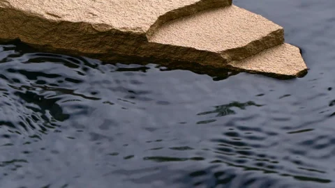 Slow motion of black water surface splashes, waves, ripples with golden stone Stockbeeldmateriaal 279299521