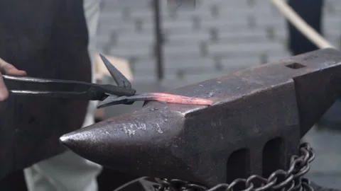 Slow Motion of Blacksmith Forging Iron Stock Footage 235971271