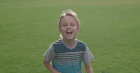 Slow Motion Blonde Boy Runs by Camera Stock Footage 61521830