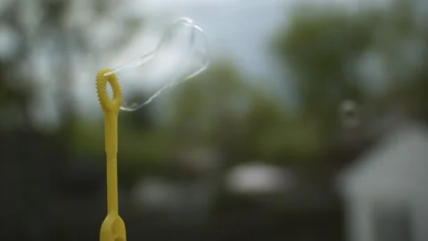 Slow motion blowing bubbles close up macro Stock-Footage 155633217