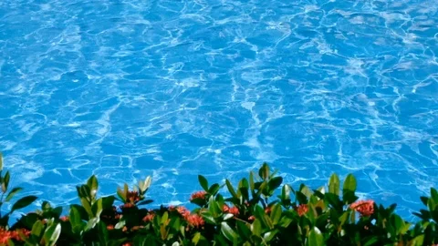 Slow motion of blue and bright ripple water surface in swimming pool Видео 102931719