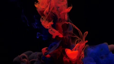 Slow motion blue and red ink paint mixing in water, swirling softly underwater Stock Footage 164461767