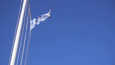Slow motion blue-and-white flag on flagpole Stock Footage 84737443