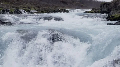 Slow motion blue glacier river flowing Iceland rapids Stock Footage 279351064