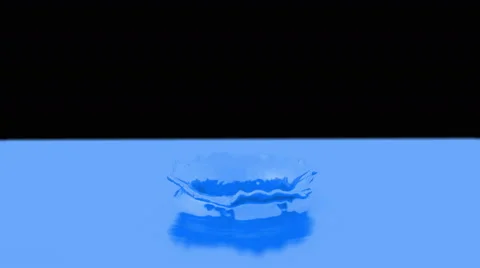Slow motion in blue paint and making beautiful crown splash Stock Footage 59737796