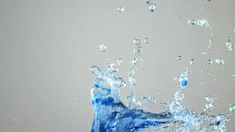 Slow motion blue paint and water explosion splash on bright white background Stock Footage 327597941