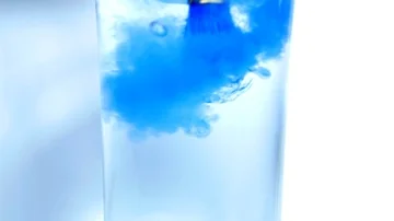 Slow motion - blue paint brush being washed in water by artist student at school Stock Footage 85678565