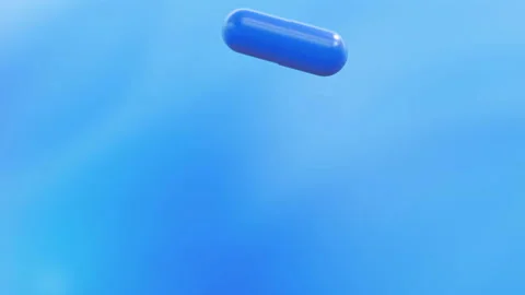 Slow motion blue tablets falling Stock Footage 102667241