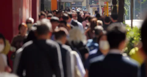 Slow motion blurred crowd walk at Nathan Road at lunchtime Stock Footage 309399927