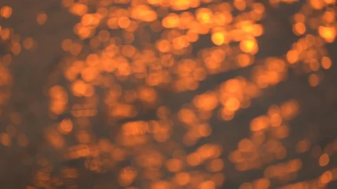 Slow motion blurred Golden background slow motion wave of light sunset on surfac Stock Footage 127403600