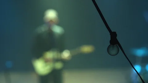 Slow Motion Of A Blurred Man Playing Bass On Stage Stock Footage 127517557