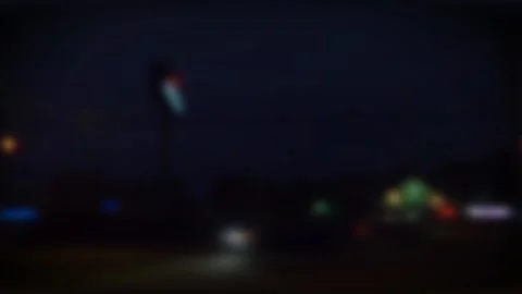 Slow Motion Blurred traffic at night on a busy road with colorful lights pass Stock Footage 153440900