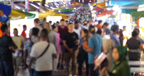 Slow motion blurred view of crowded night food street at Bukit Bintang Video stock 319013176