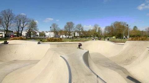 Slow motion of BMX biker jumping on bike at skate park Stock Footage 84900051