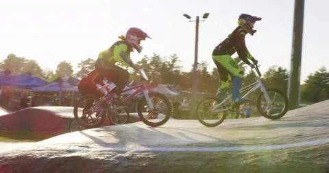 Slow Motion BMX Racing Sunset Girls Stock Footage 82049106