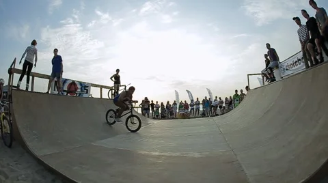 Slow Motion Of Bmx Rider during His Performing tricks in the ramp. Bmx-vert on Stock Footage 60704591