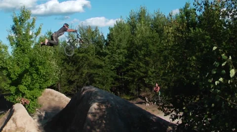 Slow motion bmx superman over huge jump Stock Footage 27694633