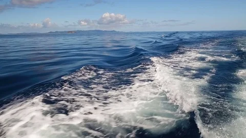 Slow motion boat wake in open blue water in virgin Islands Stock Footage 71958221