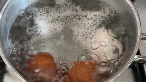 Slow Motion Boiling Eggs In Hot Water With Rising Bubbles Stock Footage 334393827