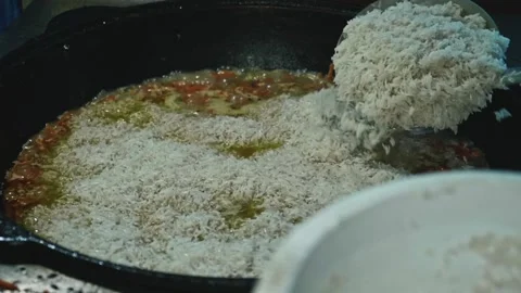 Slow motion of boiling rive in cauldron. Cooking for a big family. Stock Footage 170154402