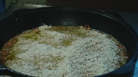 Slow motion of boiling rive in cauldron. Cooking for a big family. Stock Footage 170154527