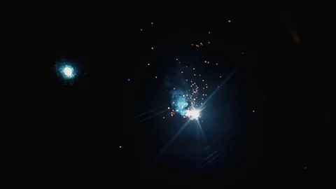 Slow motion bokeh of Blacksmith welding a piece of metal in an electric welding  Video stock 102573302