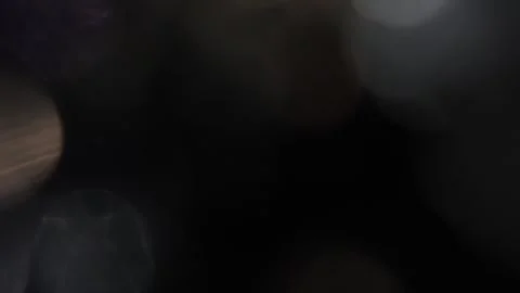 Slow motion of bokeh lights up close in the dark Видео 317452026