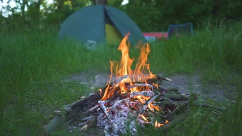 Slow motion. BonFire, campfire  and tourist camping tent Video stock 156039953