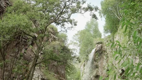 Slow motion bottom view of waterfall in Caucasian mountains Stock Footage 82903453