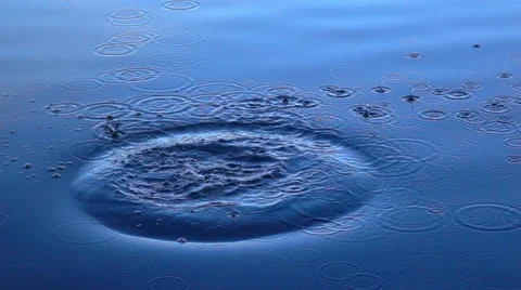 Slow motion of boulder thrown into the calm blue water. 스톡 동영상 57971496