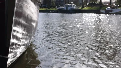 Slow motion bow detail with sun glitter on water Stock Footage 331839982