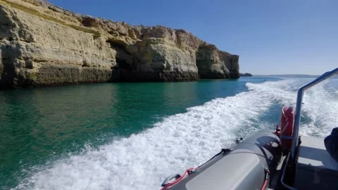 Slow motion bow wave from dinghy in Altantic ocean Stock Footage 168562946