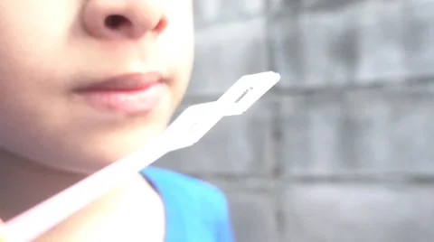 Slow motion boy blowing bubble soap Stockbeeldmateriaal 65801131