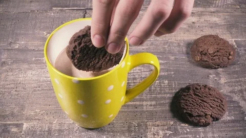 Slow motion the boy dips cookies in cocoa Stock Footage 95317767