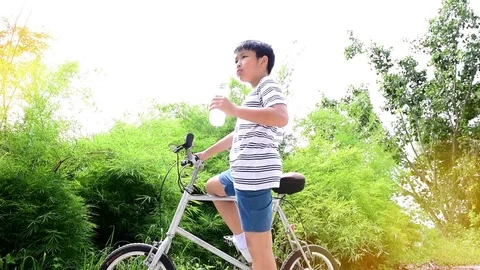 Slow motion boy drinking water Stock Footage 82447494