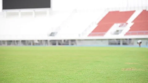 Slow motion of boy play and practice football in the stadium Stock Footage 73561015