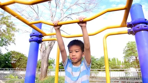 Slow motion boy play bar at playground Stock Footage 79588743
