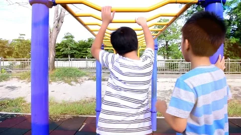 Slow motion boy play bar at playground 库存影片 79588744