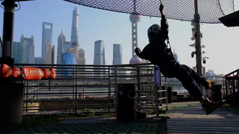 Slow Motion of boy playing at a jungle adventure park in China's Shanghai Stock Footage 301983403
