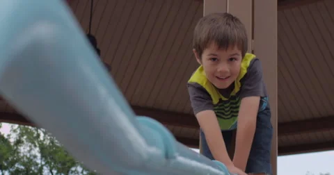 Slow Motion Boy Plays on Stair Rail Outside Stock Footage 61716524