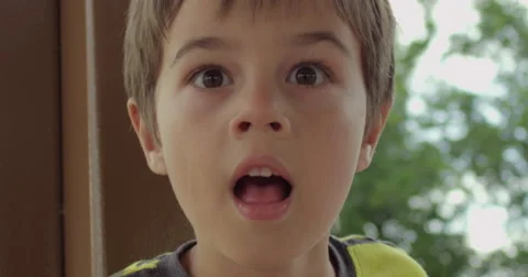Slow Motion Boy Stares in Shock or Awe Stock Footage 61717105