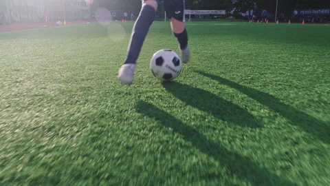 SLOW MOTION - Boy trains professionally on a football field with a ball. Stock Footage 158011677