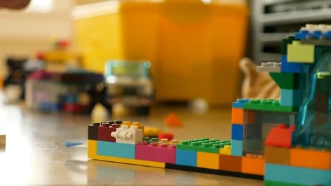 Slow motion of boys hands playing with his lego toys Stock Footage 86872722