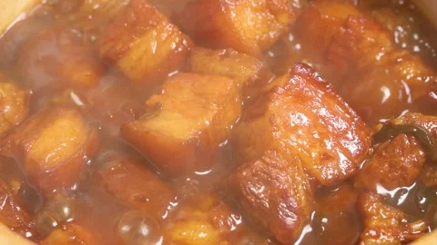 Slow Motion Braised Pork Belly Simmering in Sauce Close Up Stock Footage 341926380